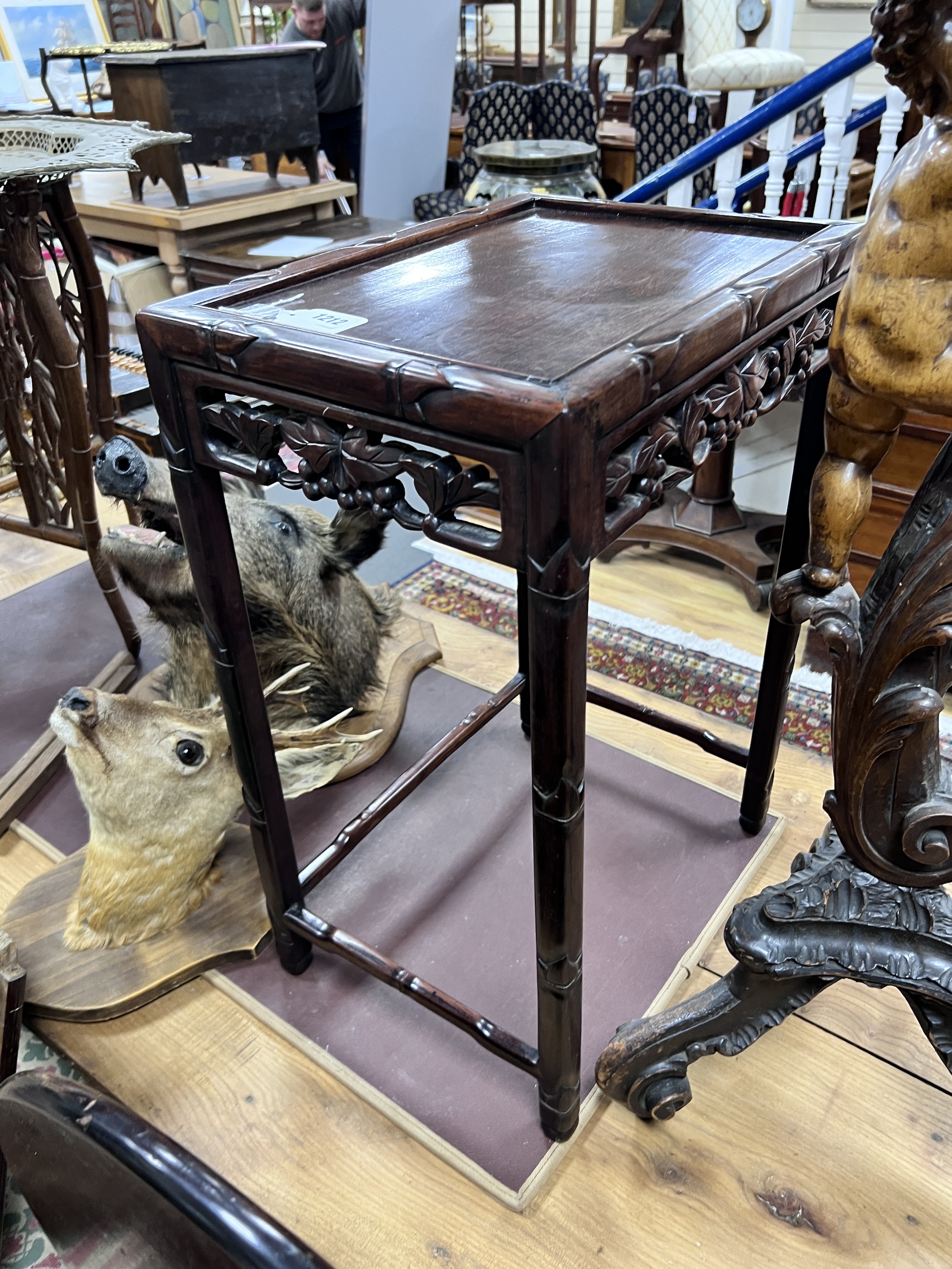 A Chinese hongmu occasional table from a nest, width 43cm